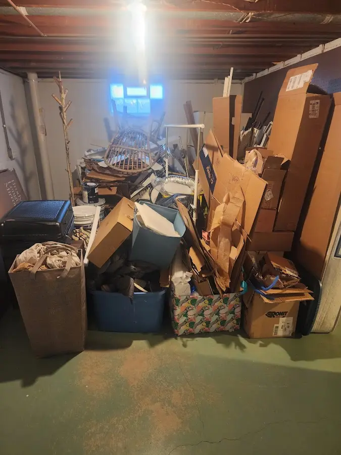 Roll-off dumpster container at job site for 4 Yard Dumpster Rental in Raymond